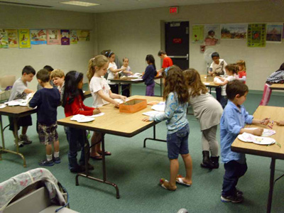 Kids Coloring at a Craft Event Presented by David Udovic